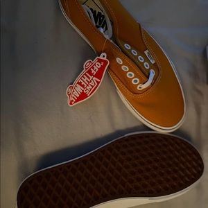 Orange Vans off the wall shoes